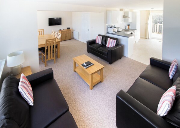 Living area - Two-storey detached cottage for up to 8 guests. (Seaview)