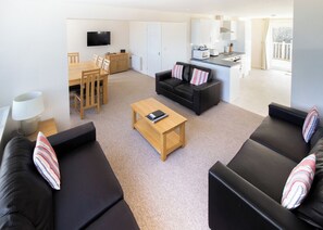 Living area - Two-storey detached cottage for up to 8 guests. (Seaview)