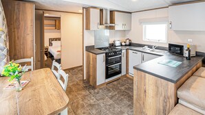 Oven, high chair - New in 2017. Luxury 12ft-wide caravan. (Milford-on-Sea, Nr Lymington)