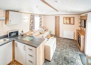 Living area - New in 2017. Luxury 12ft-wide caravan. (Milford-on-Sea, Nr Lymington)