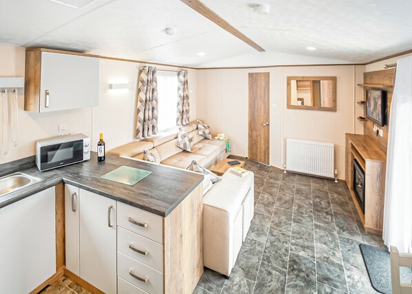 Living area - New in 2017. Luxury 12ft-wide caravan. (Milford-on-Sea, Nr Lymington)
