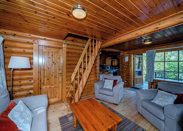 Living area - Timber lodge set in an elevated position with views of the lake. (Webbery, Bideford)
