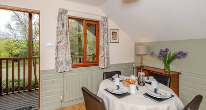 Timber lodge set by the lake with one double and one twin.