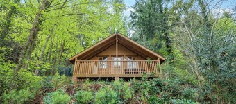 Timber lodge set by the lake with one double and one twin.
