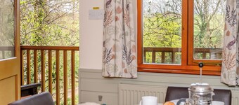 Timber lodge set by the lake with one double and one twin.