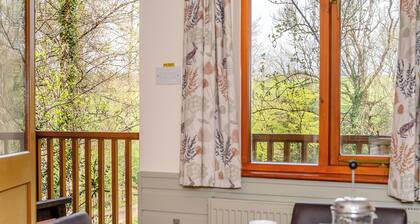 Timber lodge set by the lake with one double and one twin.