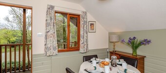Timber lodge set by the lake with one double and one twin.