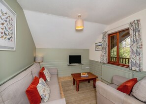 Living area - Timber lodge set by the lake with one double and one twin. (Webbery, Bideford)