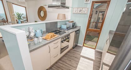 Top of the range and extremely spacious five star luxury 20ft-wide lodge.