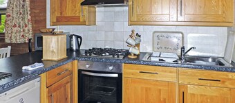 Timber lodge with one queen size double and one twin.