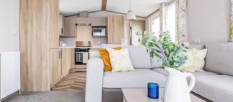 Modern, stylish and spacious 12ft-wide caravan with one double and two twin.