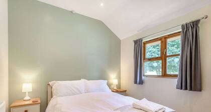 Lodge with one king-size double with en suite shower.