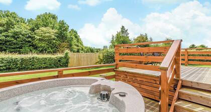 Luxury lodge with king-size bed with en suite shower.