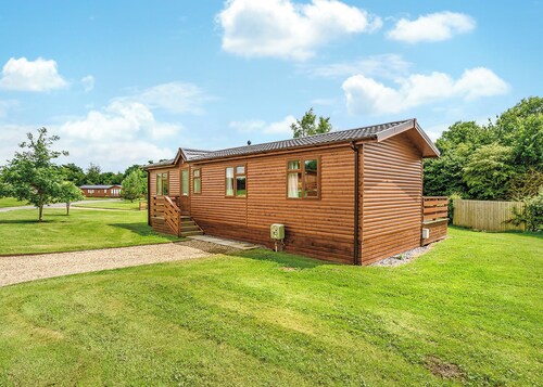 Luxury lodge with king-size bed with en suite shower.