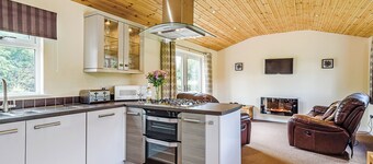 Luxury lodge with king-size bed with en suite shower.