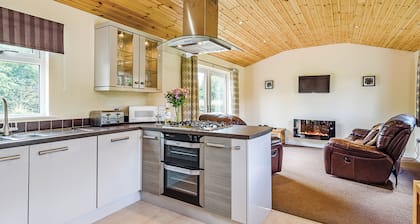 Luxury lodge with king-size bed with en suite shower.