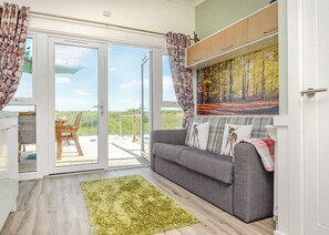 Living area - Luxurious and contemporary studio pod with double sofa bed. (Narberth)