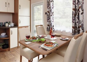 Dining - 12ft-wide caravan with one double and one twin. (Silloth)