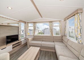 Living area - Modern and spacious 12ft-wide caravan with one double and two twin. (Budleigh Salterton)