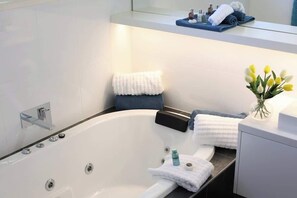 Bathtub, hair dryer, towels