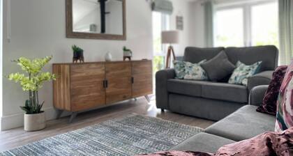 Experience the ultimate retreat in this stunning woodland lodge.