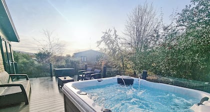 Experience the ultimate retreat in this stunning woodland lodge.