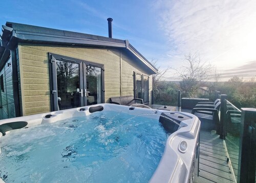 Experience the ultimate retreat in this stunning woodland lodge.