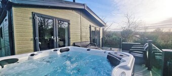Experience the ultimate retreat in this stunning woodland lodge.