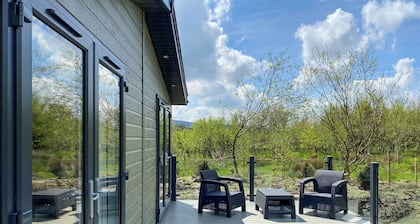 Experience the ultimate retreat in this stunning woodland lodge.