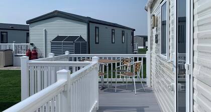 Modern and contemporary 12ft-wide caravan with one double and one twin.