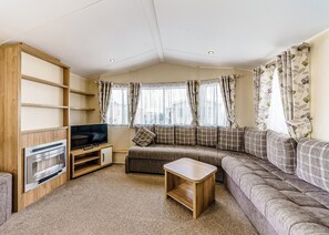 Living area - Modern and contemporary 12ft-wide caravan with one double and one twin. (Bleadon, Weston-Super-Mare)