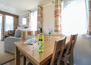Dining - Stylish 12ft-wide caravan with one double and two twin. (Swanage)