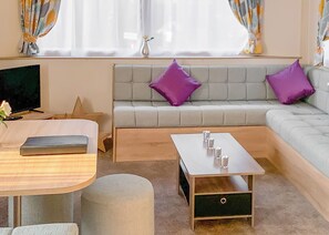 Living area - New for 2019. Contemporary caravan with one double and two twin. (Cargill)