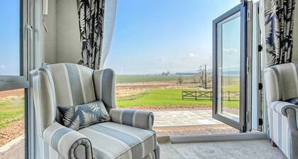 Stylish and comfortable holiday home featuring your own private hot tub.