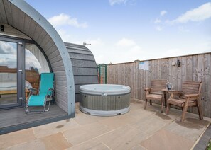 A hot tub, wooden deck, and a covered outdoor seating area with a view of the sky. - 0 bedroom accommodation in Great Busby (Great Busby)
