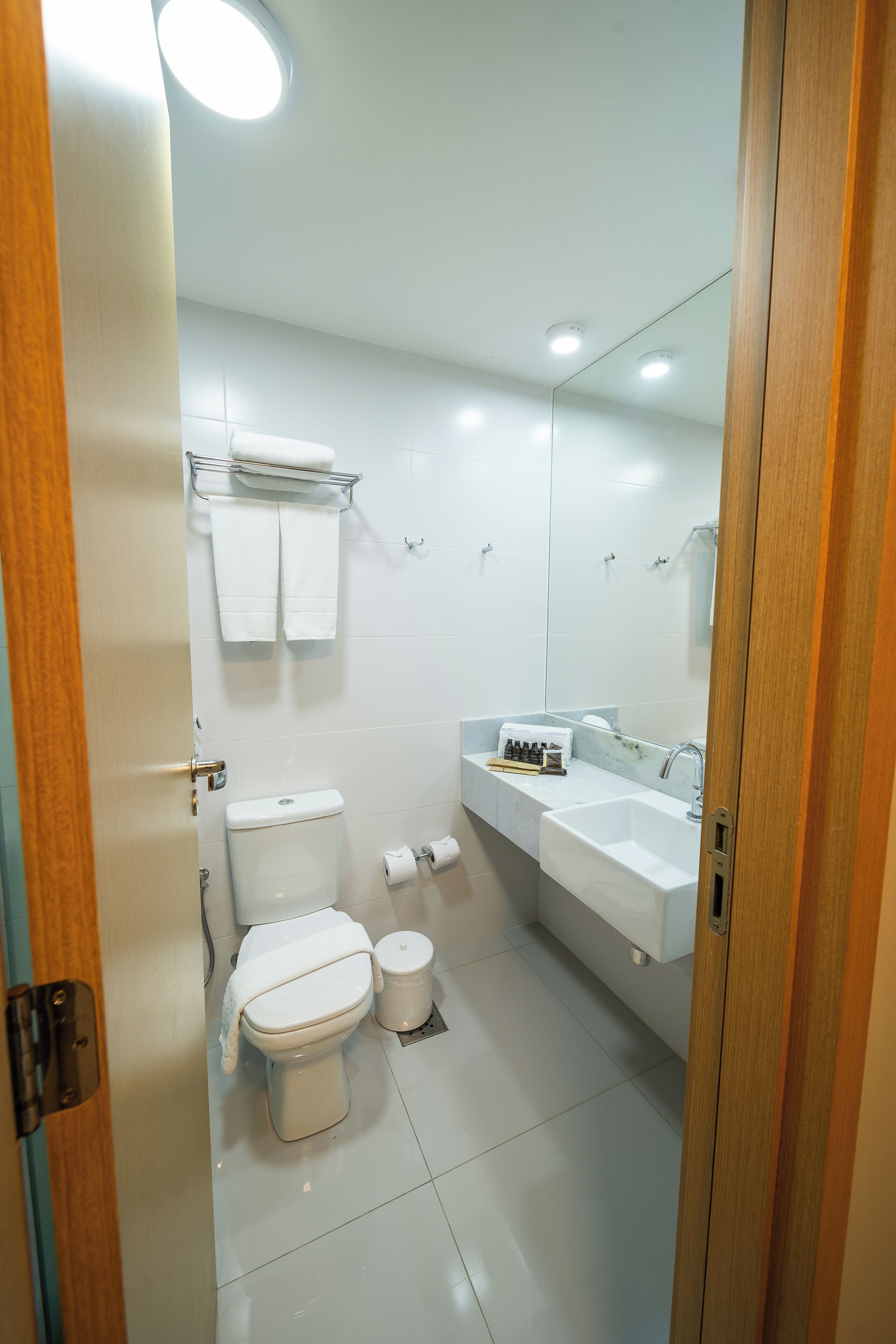 deluxe room | bathroom | shower, hair dryer, towels, soap
