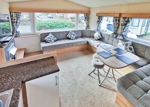 Living area - The Gold Plus 2 caravan (pet) is 12ft wide with one double and one twin. (Clarach Bay, Nr Aberystwyth)