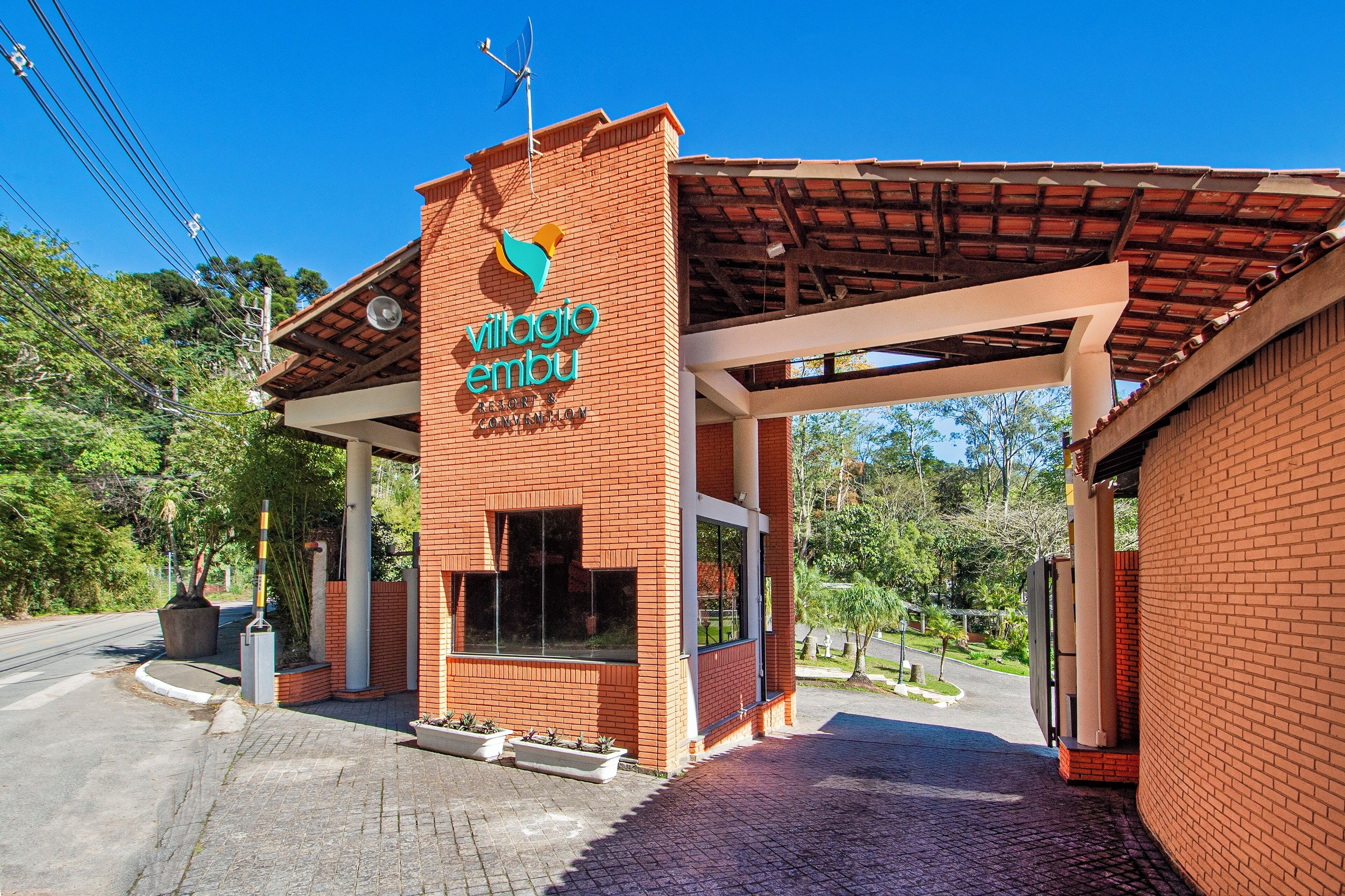 A brick building with a sign reading "village ambu."