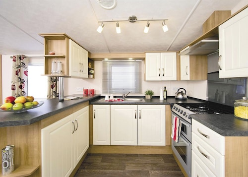 Top of the range 12ft-wide caravan with one double and one twin.
