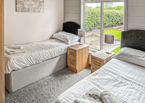 Luxury lodge with one double with en suite shower and one twin.