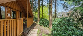 Timber lodge set in an elevated position with views of the lakes.