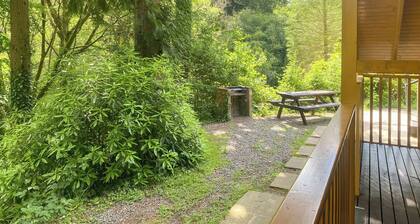 Timber lodge set in an elevated position with views of the lakes.