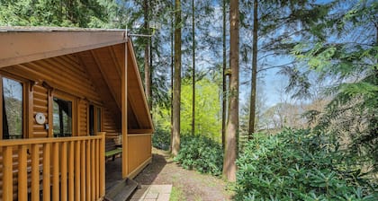 Timber lodge set in an elevated position with views of the lakes.