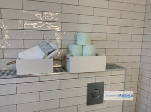 Shower, hair dryer, towels, toilet paper