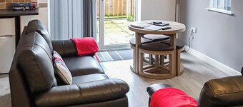 Comfortable modern cottage with one double and one with adult size bunks.