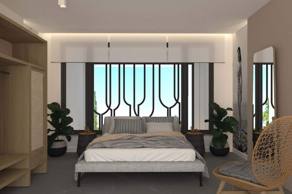 A modern bedroom with a large bed, a wooden wardrobe, and two potted plants.