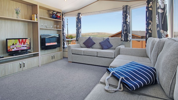 Unclassified image, 1 of 6, button - Stylish 12ft-wide caravan with one double and one twin. (Swanage)