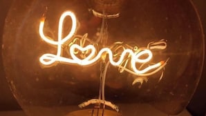 A spherical light fixture with the word "Love" written in a cursive script. - Modernly Equipped Country House, 5 minutes from Natural Swimming Pools (Altares)