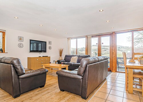 Luxury lodge residing at the top of the wooded valley.