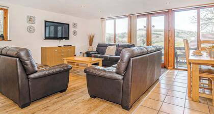 Luxury lodge residing at the top of the wooded valley.